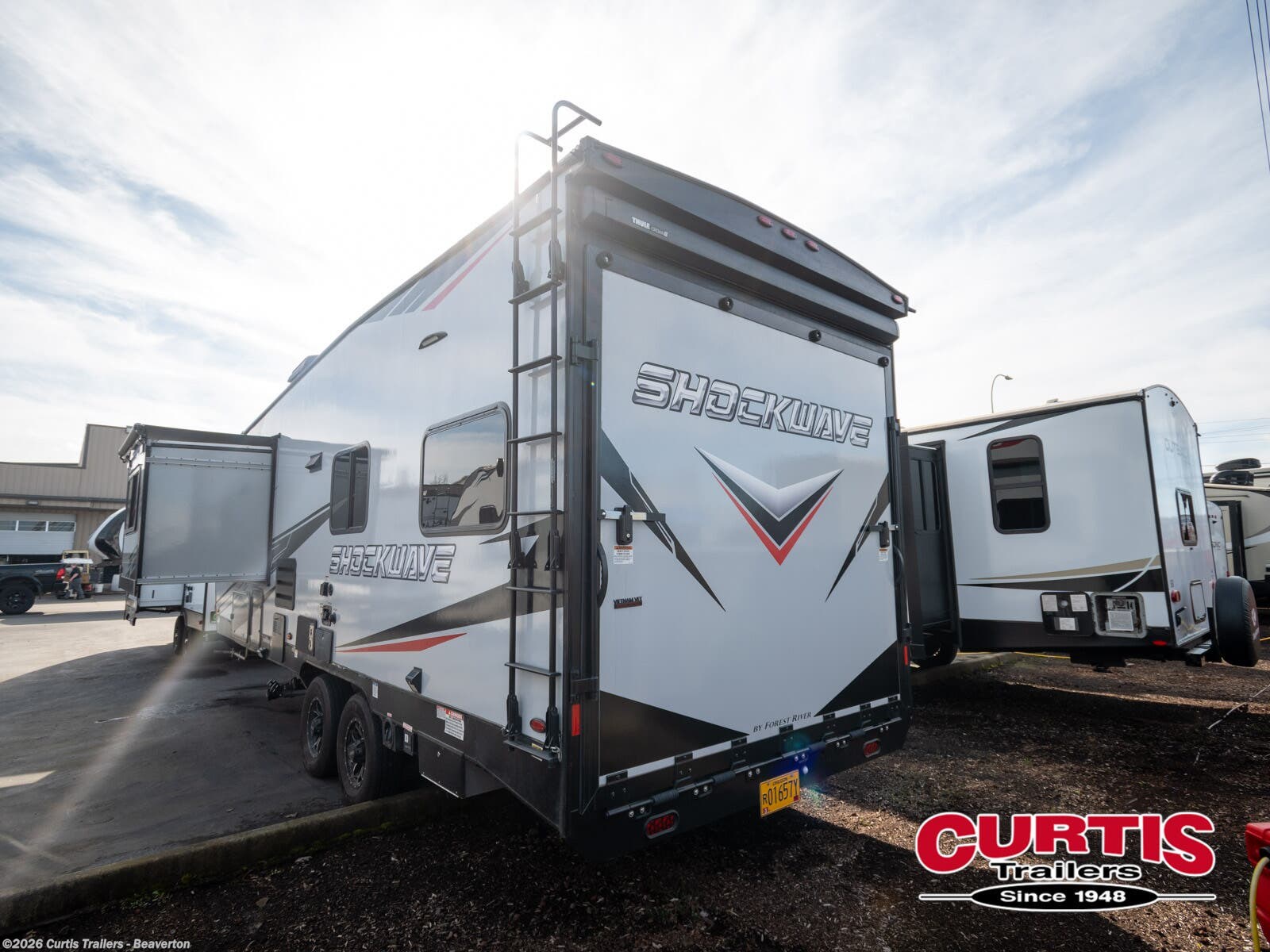 Call now about this 2022 Forest River Shockwave 24QSGMX! 2022 Forest River Shockwave 24QSGMX - Used Toy Hauler For Sale by Curtis Trailers - Beaverton in Beaverton, Oregon