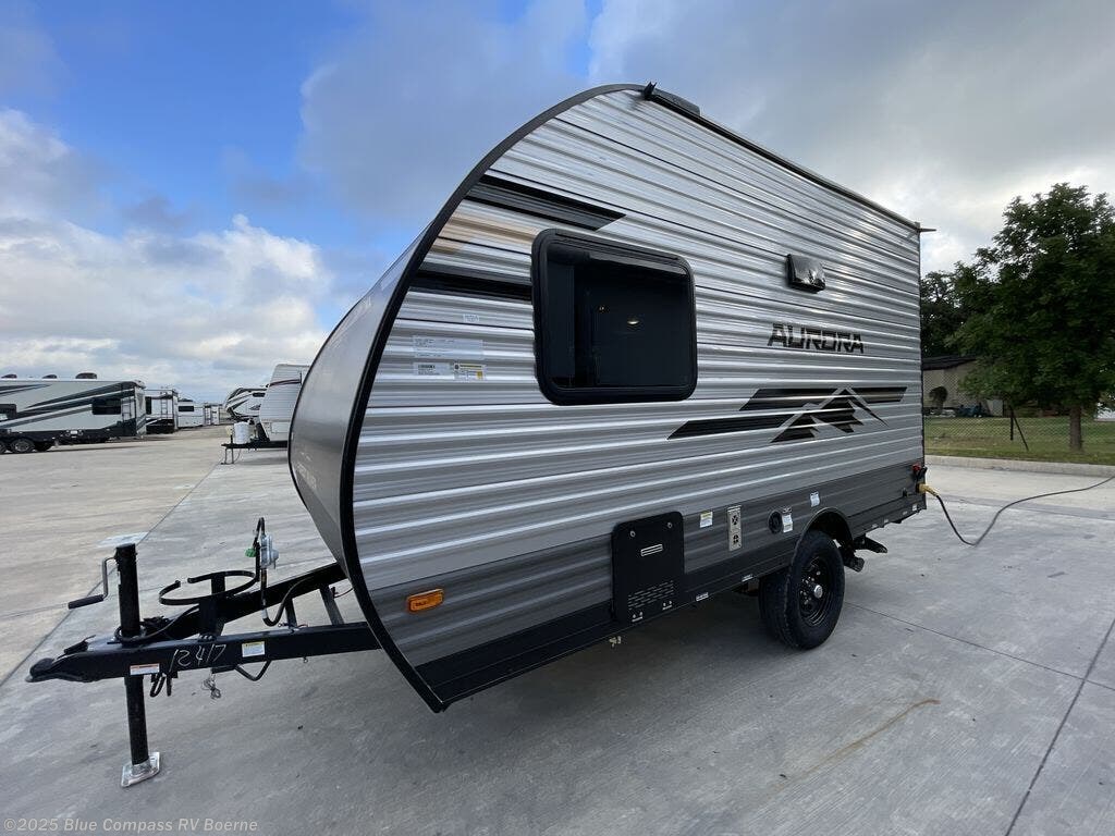 Contact us now about this 2026 Forest River Aurora Light 13RDX! 2026 Aurora Light 13RDX by Forest River from Blue Compass RV Boerne in Boerne, Texas