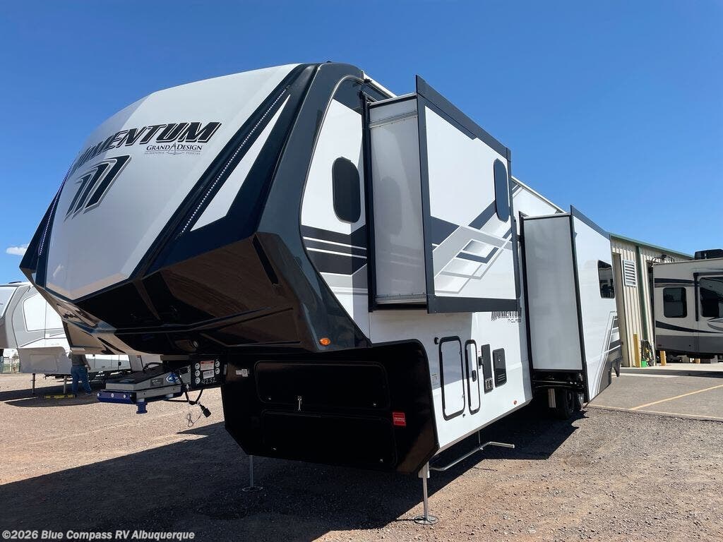 Call now about this 2026 Grand Design Momentum M-Class 395MS! 2026 Grand Design Momentum M-Class 395MS - New Toy Hauler For Sale by Blue Compass RV Albuquerque in Albuquerque, New Mexico features Slideout