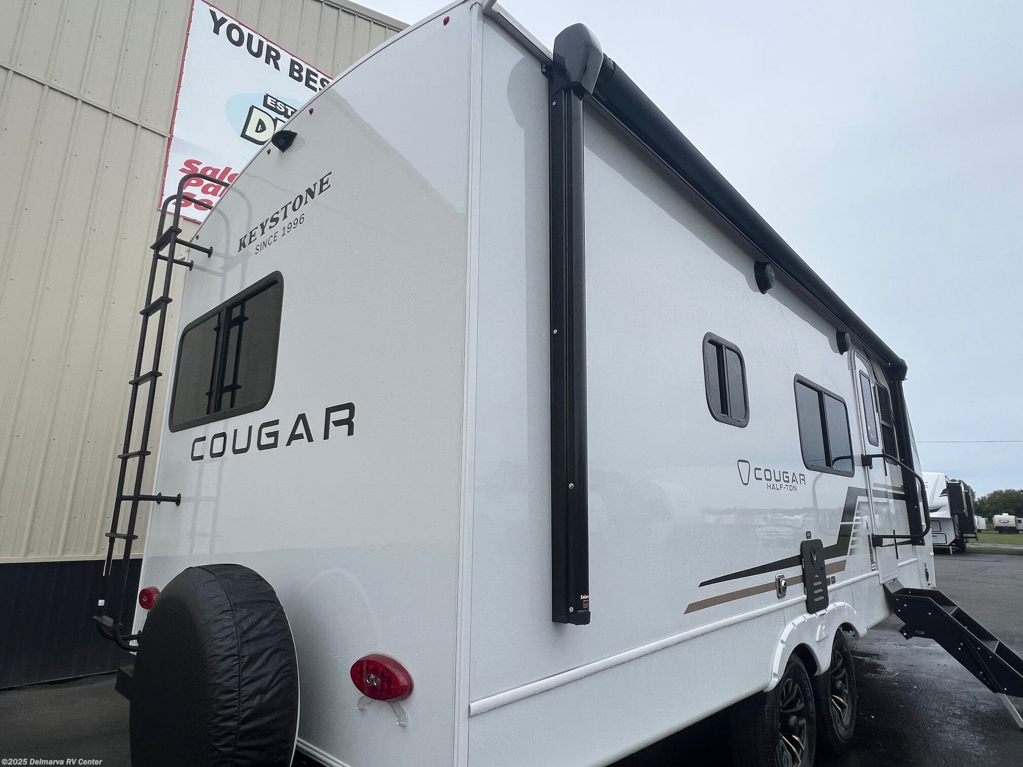 Call now about this 2026 Keystone Cougar Half-Ton 22MLS! 2026 Keystone Cougar Half-Ton 22MLS - New Travel Trailer For Sale by Delmarva RV Center (Milford North) in Milford North, Delaware features Ladder, Slideout, Refrigerator, Insulated, Awning