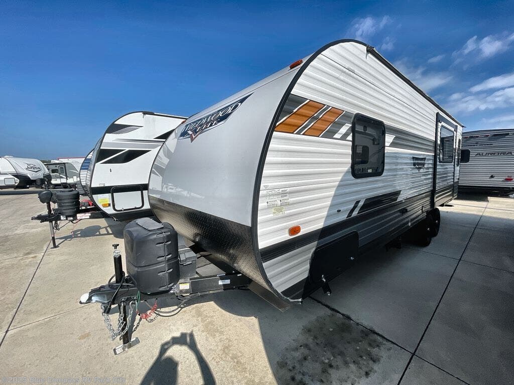 Contact us now about this 2021 Forest River Wildwood 24RLXL! 2021 Wildwood 24RLXL by Forest River from Blue Compass RV Park City in Park City, Kansas