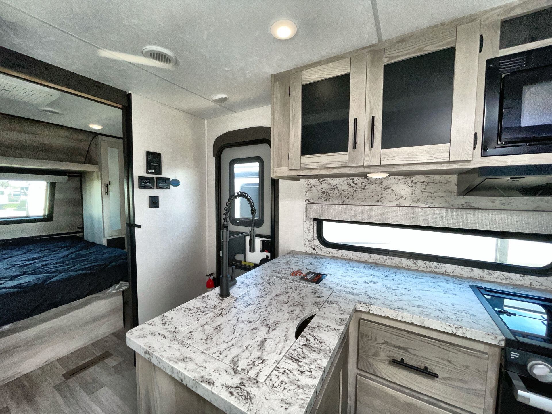 Call now about this 2023 K-Z Connect 291BHK! 2023 K-Z Connect 291BHK - Used Travel Trailer For Sale by McClain's RV Fort Worth in Fort Worth, Texas features Black Tank Flush, Roof Deck, Fireplace, Hitch, Ladder