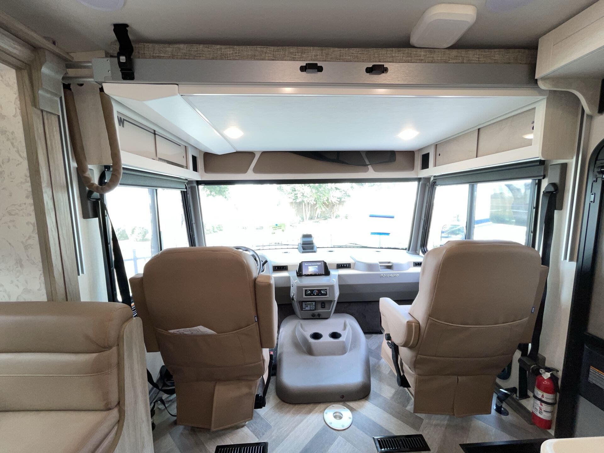 Call now about this 2023 Winnebago Adventurer 35F! 2023 Winnebago Adventurer 35F - Used Class A For Sale by McClain's RV Fort Worth in Fort Worth, Texas features Shower, Fireplace, Heat Pump, Dryer, Fire Extinguisher