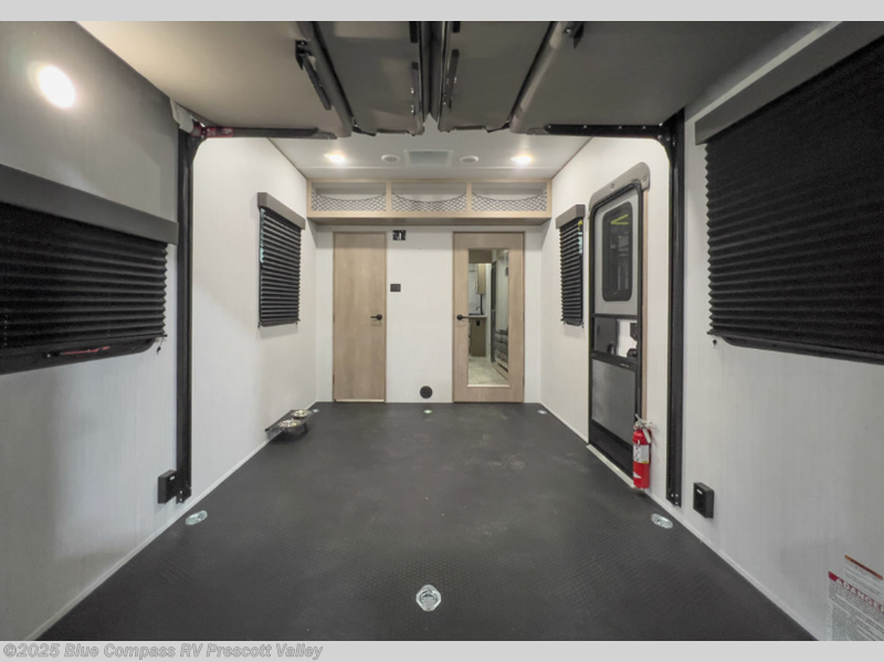 Call now about this 2025 Grand Design Momentum G-Class 31G! 2025 Grand Design Momentum G-Class 31G - New Toy Hauler For Sale by Blue Compass RV Prescott Valley in Prescott Valley, Arizona features Slideout