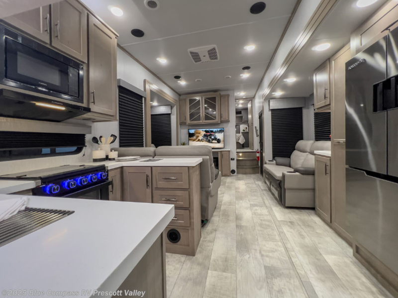 Call now about this 2025 Grand Design Momentum G-Class 415G! 2025 Grand Design Momentum G-Class 415G - New Toy Hauler For Sale by Blue Compass RV Prescott Valley in Prescott Valley, Arizona features Slideout