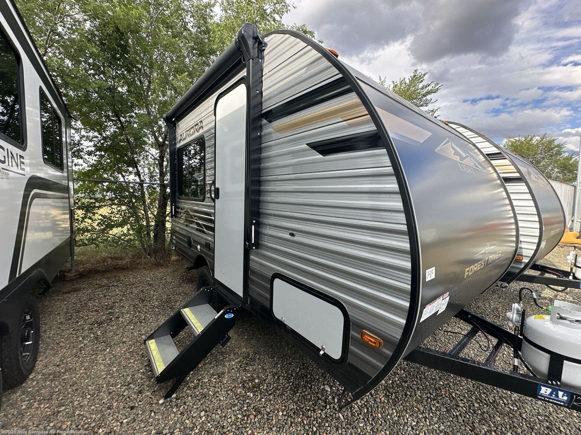 Contact us now about this 2026 Forest River Aurora Light 13RDX! 2026 Aurora Light 13RDX by Forest River from Blue Compass RV Prescott Valley in Prescott Valley, Arizona