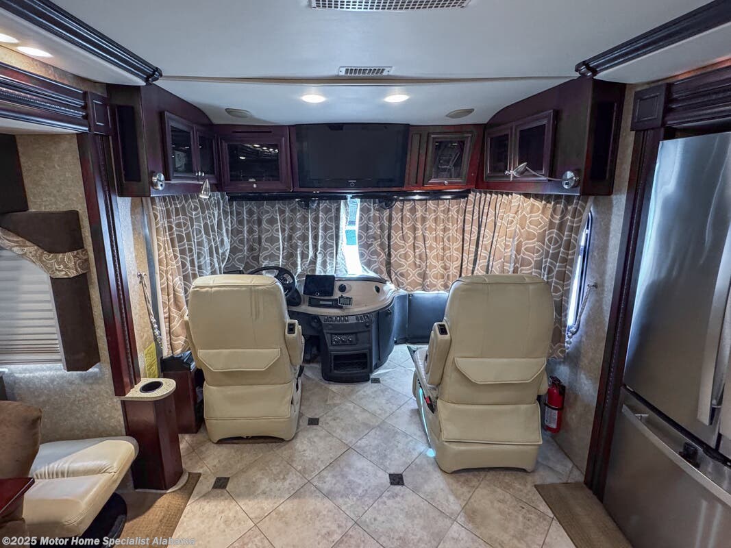 Call now about this 2009 Fleetwood Revolution LE 42K! 2009 Fleetwood Revolution LE 42K - Used Diesel Pusher For Sale by Motor Home Specialist Alabama in Montgomery, Alabama features Bath & 1/2