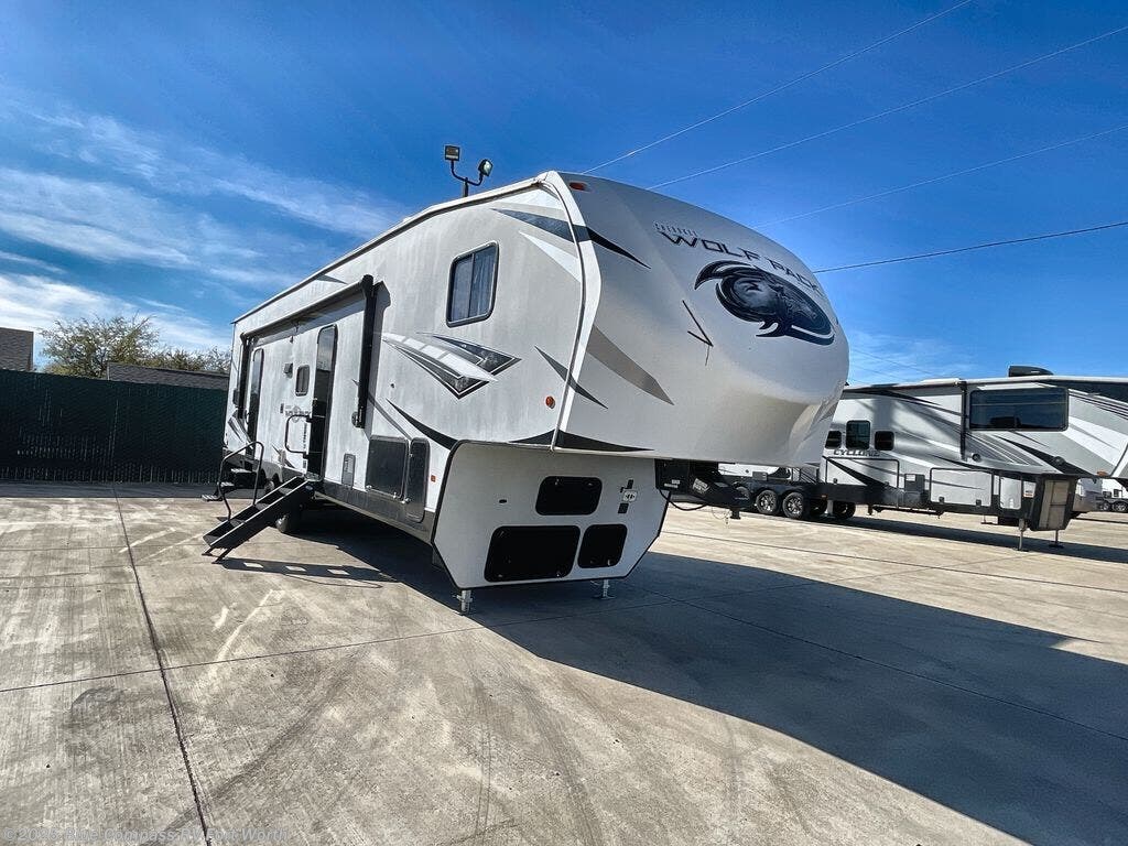 Contact us now about this 2021 Forest River Cherokee Wolf Pack 315PACK12! 2021 Cherokee Wolf Pack 315PACK12 by Forest River from Blue Compass RV Fort Worth in Fort Worth, Texas