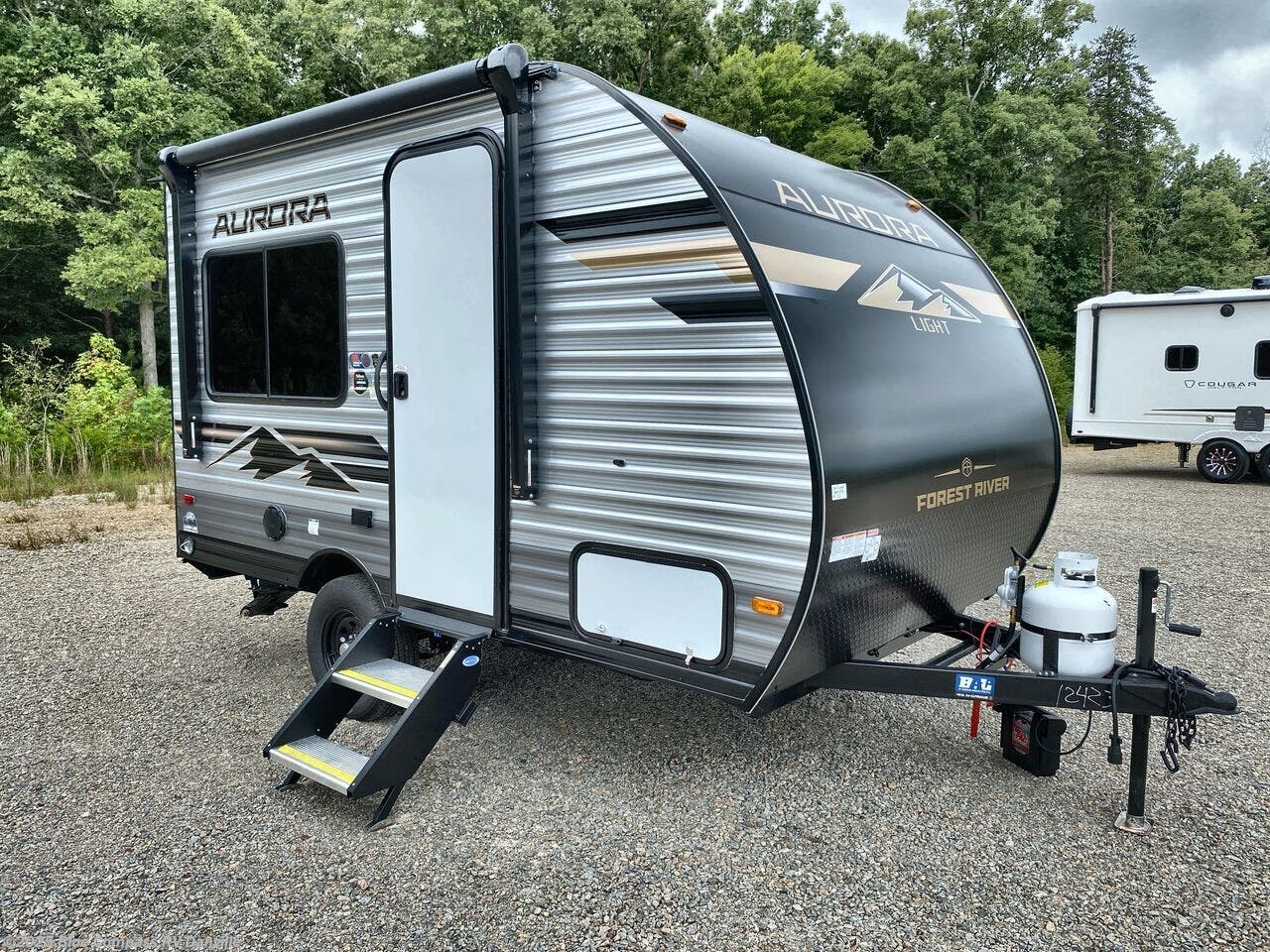Contact us now about this 2026 Forest River Aurora Light 13RDX! 2026 Aurora Light 13RDX by Forest River from Blue Compass RV Danville in Ringgold, Virginia