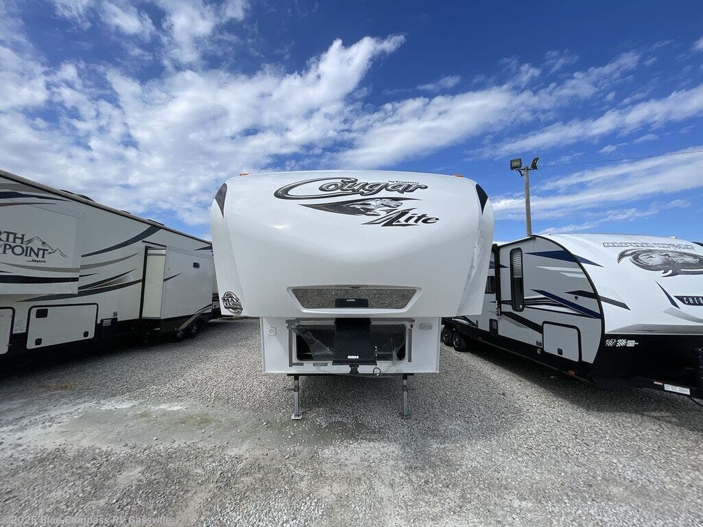 Contact us now about this 2011 Keystone Cougar 29RES! 2011 Cougar 29RES by Keystone from Blue Compass RV Gassville in Gassville, Arkansas