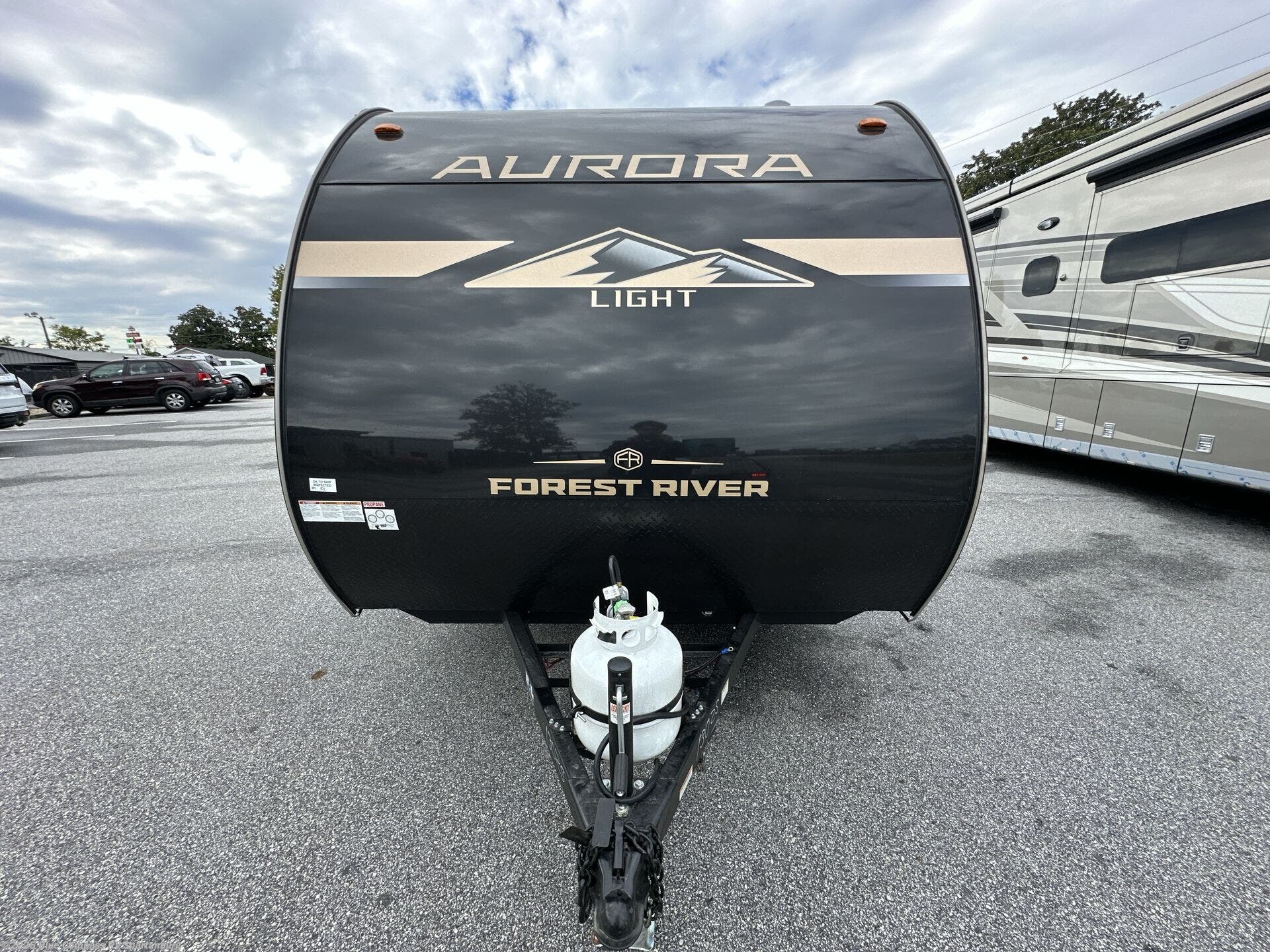 Contact us now about this 2026 Forest River Aurora Light 13RKX! 2026 Aurora Light 13RKX by Forest River from Blue Compass RV Spartanburg in Duncan, South Carolina