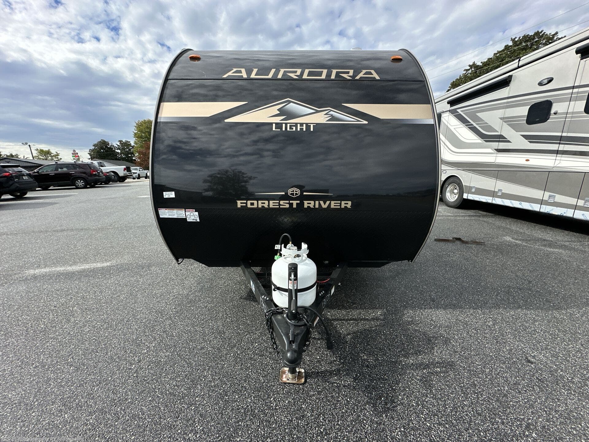 Contact us now about this 2026 Forest River Aurora Light 13RKX! 2026 Aurora Light 13RKX by Forest River from Blue Compass RV Spartanburg in Duncan, South Carolina