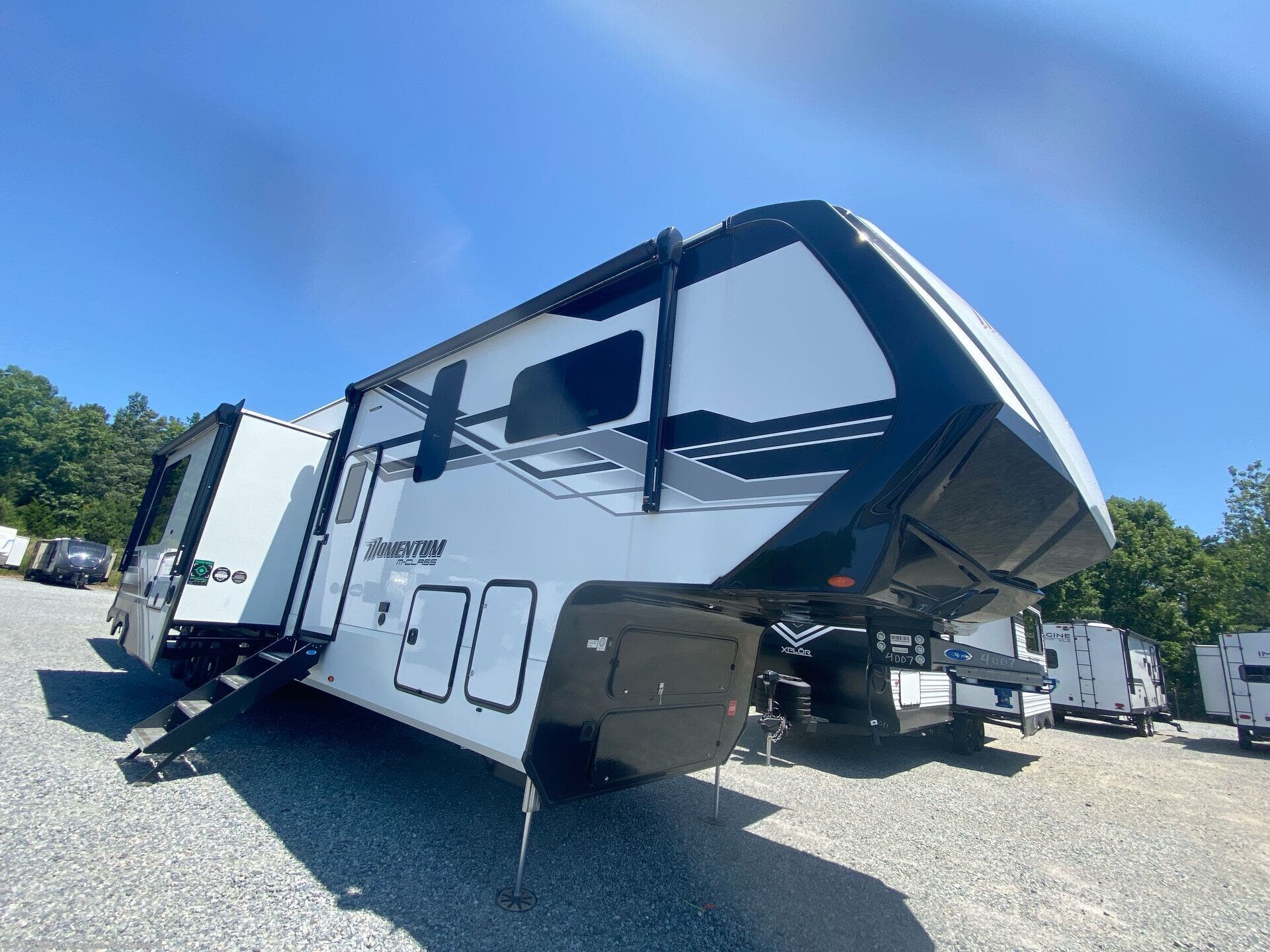 Contact us now about this 2025 Grand Design Momentum M-Class 414M! 2025 Momentum M-Class 414M by Grand Design from Blue Compass RV Concord in Concord, North Carolina