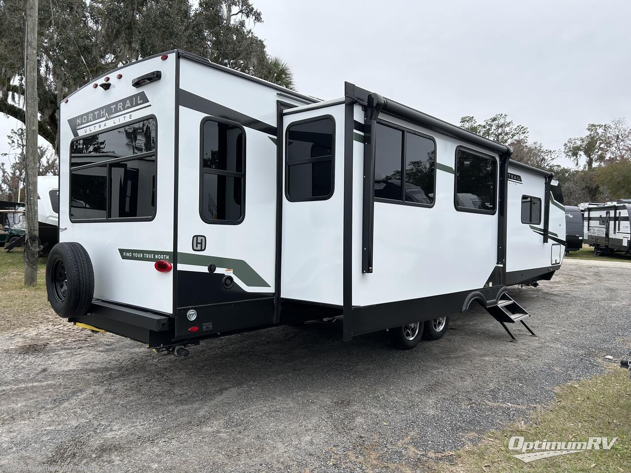 Call now about this 2025 Heartland North Trail 3411-RL! 2025 Heartland North Trail 3411-RL - New Travel Trailer For Sale by Optimum RV - Ocala in Ocala, Florida features Awning, Slideout