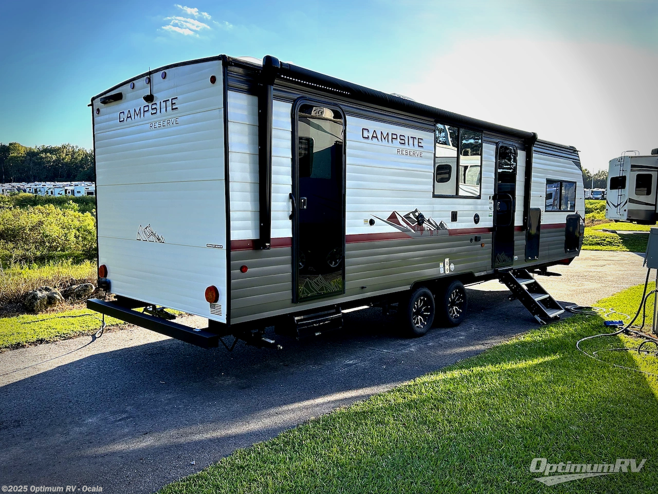 Call now about this 2025 Forest River Campsite Reserve 26CJ! 2025 Forest River Campsite Reserve 26CJ - Used Travel Trailer For Sale by Optimum RV - Ocala in Ocala, Florida features Slideout, Awning