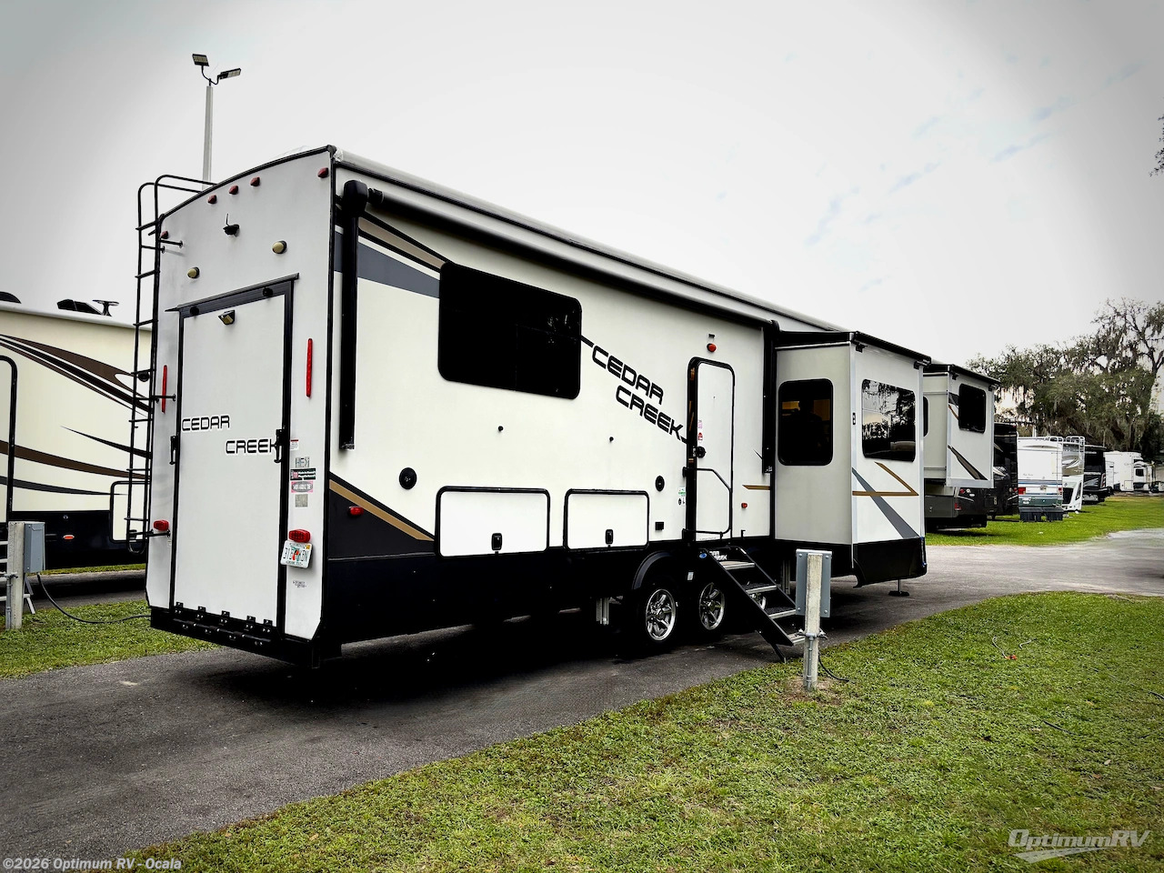 Call now about this 2022 Forest River Cedar Creek 385TH! 2022 Forest River Cedar Creek 385TH - Used Fifth Wheel For Sale by Optimum RV - Ocala in Ocala, Florida features Slideout, Awning