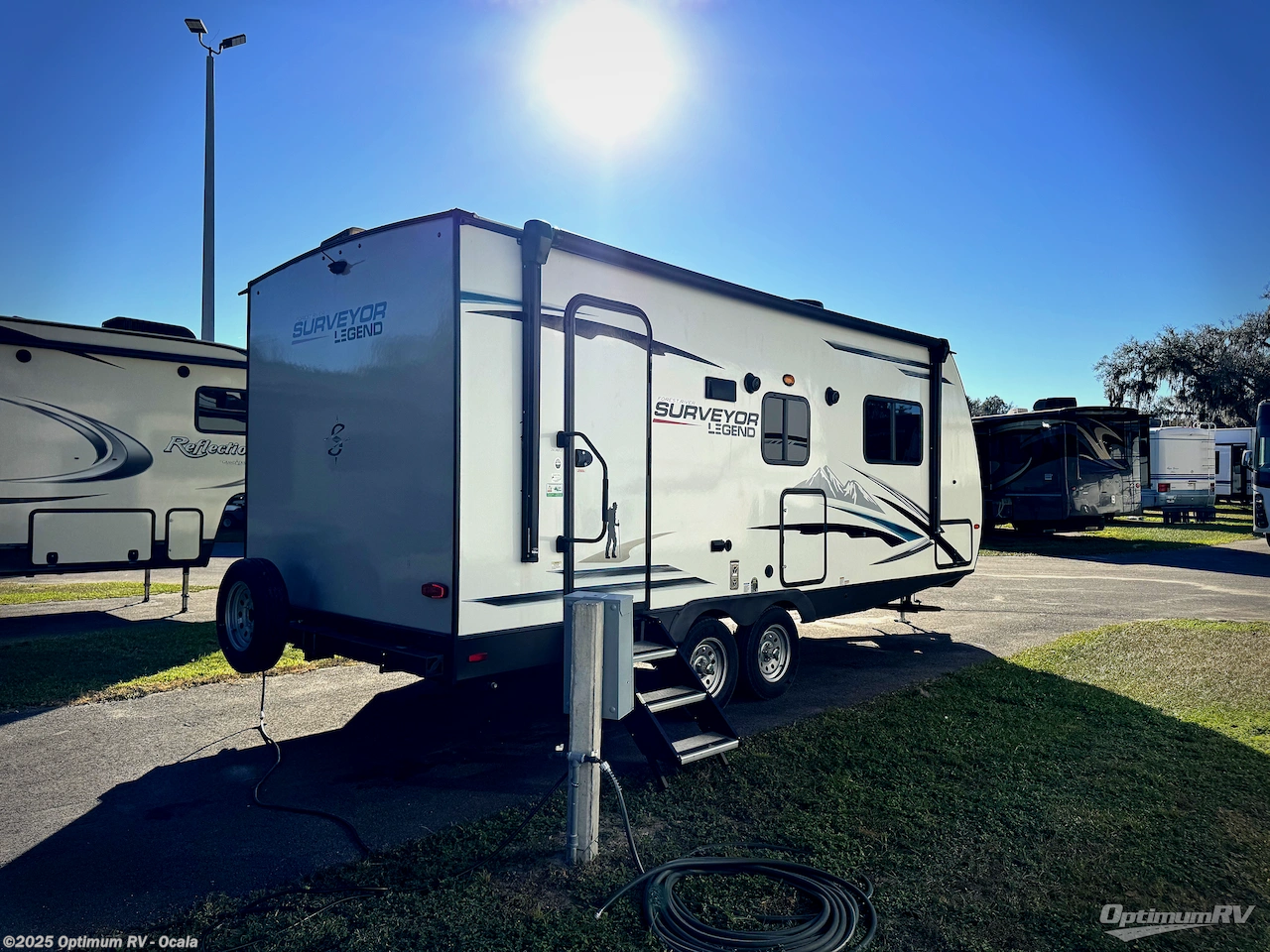 Call now about this 2021 Forest River Surveyor 202RBLE! 2021 Forest River Surveyor 202RBLE - Used Travel Trailer For Sale by Optimum RV - Ocala in Ocala, Florida features Awning, Slideout