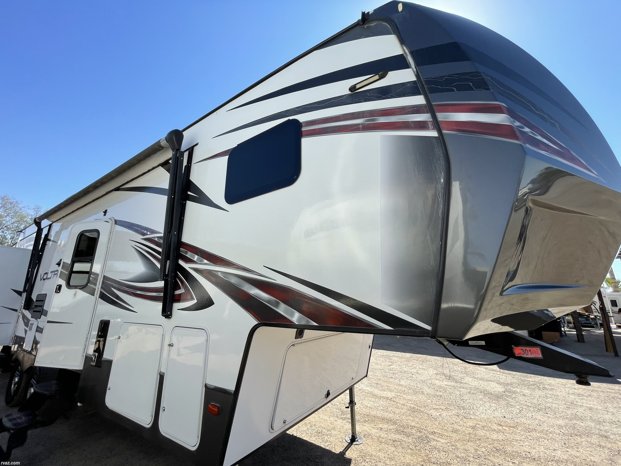 Call now about this 2016 Dutchmen Voltage V3005! 2016 Dutchmen Voltage V3005 - Used Toy Hauler For Sale by RV AZ Corral in Mesa, Arizona features Tinted Windows, Toilet, Refrigerator, CD Player, Enclosed Underbelly