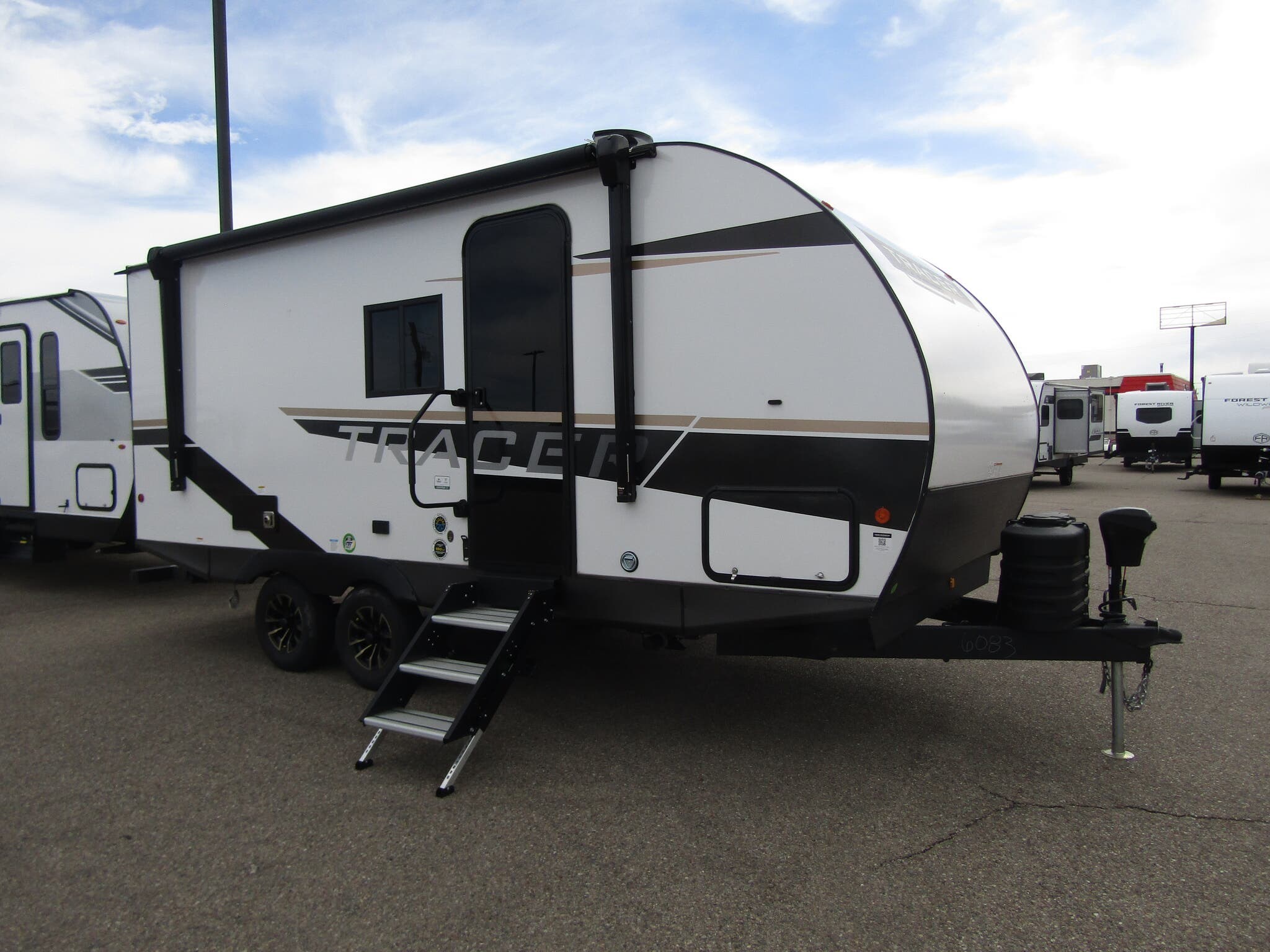 Call now about this 2025 Prime Time Tracer LE 190RBSLE! 2025 Prime Time Tracer LE 190RBSLE - New Travel Trailer For Sale by First Choice RVs in Rock Springs, Wyoming features Roof Vents, Power Awning, Toilet, Auxiliary Battery, Exterior Speakers