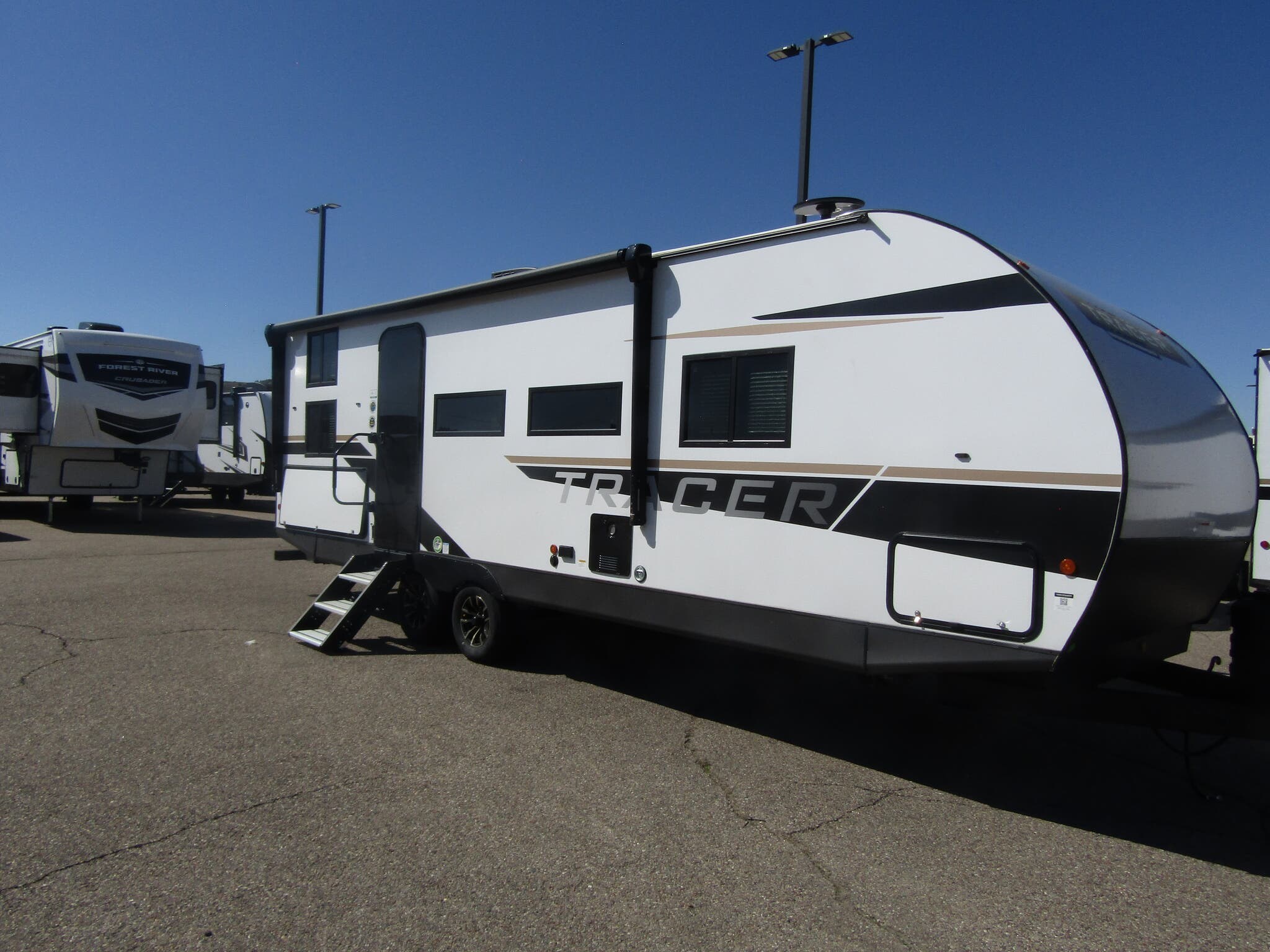 Call now about this 2025 Prime Time Tracer 250BH! 2025 Prime Time Tracer 250BH - New Travel Trailer For Sale by First Choice RVs in Rock Springs, Wyoming features Exterior Speakers, Leveling Jacks, Free Standing Dinette w/Chairs, Power Roof Vent, Refrigerator
