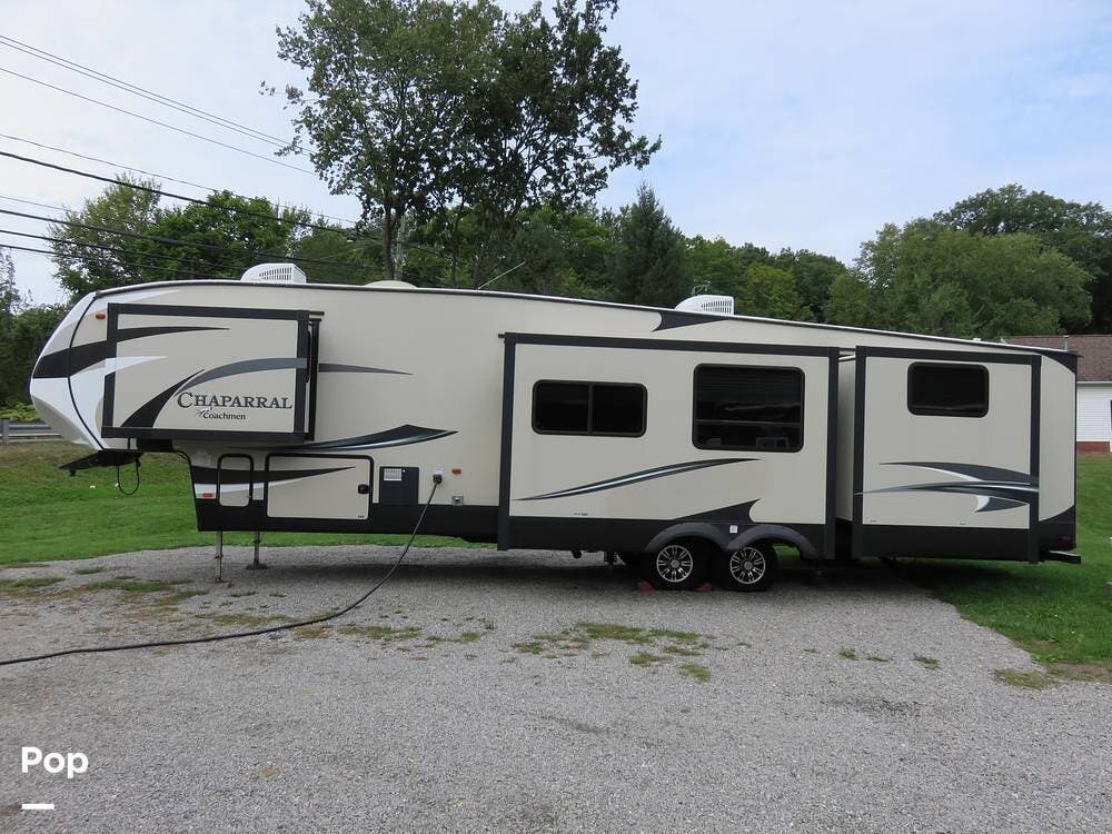 Call now about this 2017 Coachmen Chaparral 372QBH! 2017 Coachmen Chaparral 372QBH - Used Fifth Wheel For Sale by Pop RVs in East Berlin, Connecticut features Awning, Air Conditioning, Slideout