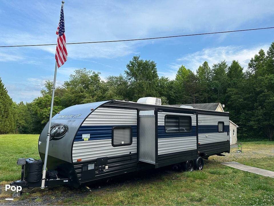 Call now about this 2021 Forest River Grey Wolf 27RR! 2021 Forest River Grey Wolf 27RR - Used Toy Hauler For Sale by Pop RVs in Reidsville, North Carolina features Slideout, Leveling Jacks, Awning, Air Conditioning