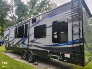 Call now about this 2016 Keystone Fuzion FZ345! 2016 Keystone Fuzion FZ345 - Used Toy Hauler For Sale by Pop RVs in Auburn, Massachusetts features Air Conditioning, Leveling Jacks, Awning, Slideout, Generator