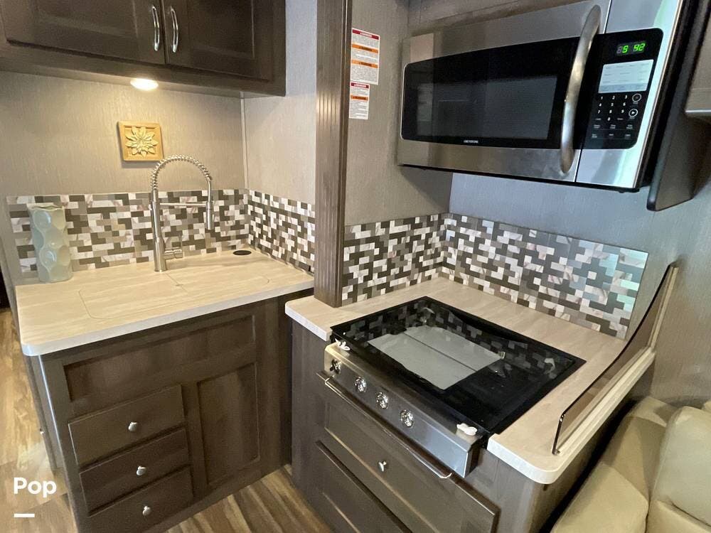 Call now about this 2022 Nexus Triumph 34TSC! 2022 Nexus Triumph 34TSC - Used Super C For Sale by Pop RVs in Flat Rock, Michigan features Slideout, Awning, Generator, Leveling Jacks, Air Conditioning