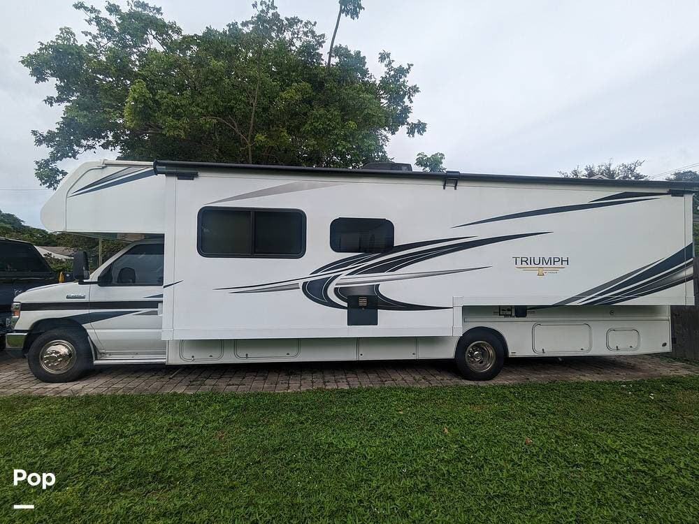 Call now about this 2020 Nexus Triumph 30T! 2020 Nexus Triumph 30T - Used Class C For Sale by Pop RVs in Dania Beach, Florida features Awning, Slideout, Generator, Air Conditioning, Leveling Jacks