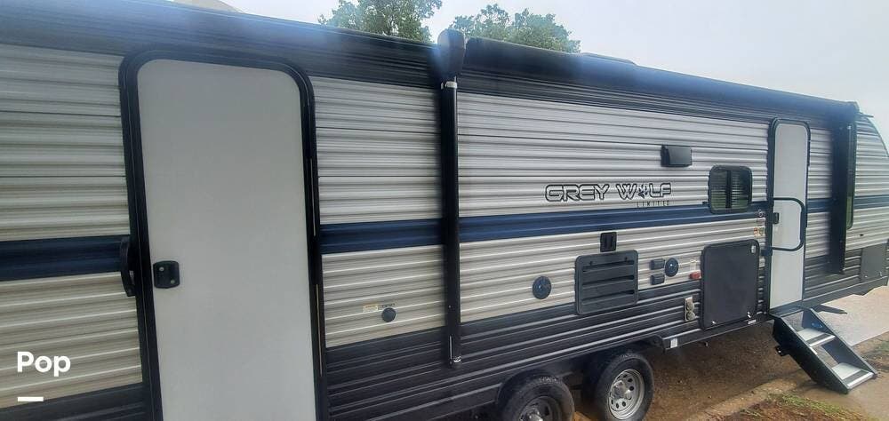 Call now about this 2020 Forest River Grey Wolf 26DBH! 2020 Forest River Grey Wolf 26DBH - Used Travel Trailer For Sale by Pop RVs in Allen, Texas features Slideout, Air Conditioning, Leveling Jacks, Awning
