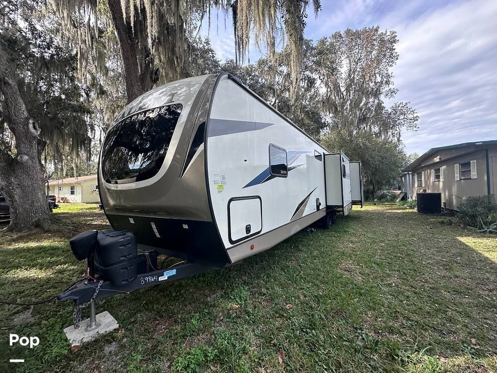 Call now about this 2022 Forest River Hemisphere 310BHI! 2022 Forest River Hemisphere 310BHI - Used Travel Trailer For Sale by Pop RVs in Lake Panasoffkee, Florida features Air Conditioning, Awning, Leveling Jacks, Slideout