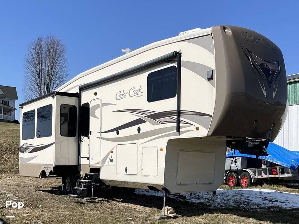 Call now about this 2016 Forest River Cedar Creek 36CKTS! 2016 Forest River Cedar Creek 36CKTS - Used Fifth Wheel For Sale by Pop RVs in Zanesville, Ohio features Leveling Jacks, Awning, Slideout, Air Conditioning