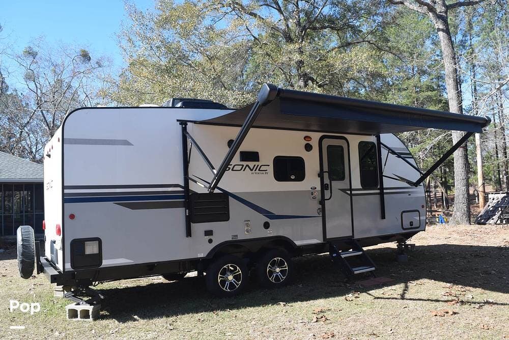 Call now about this 2021 Venture RV Sonic 220VBH! 2021 Venture RV Sonic 220VBH - Used Travel Trailer For Sale by Pop RVs in Brewton, Alabama features Air Conditioning, Awning, Slideout, Leveling Jacks