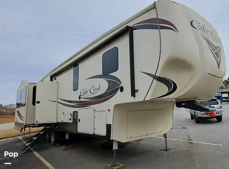 Call now about this 2018 Forest River Cedar Creek 37MBH! 2018 Forest River Cedar Creek 37MBH - Used Fifth Wheel For Sale by Pop RVs in Waddell, Arizona features Awning, Air Conditioning, Leveling Jacks, Slideout