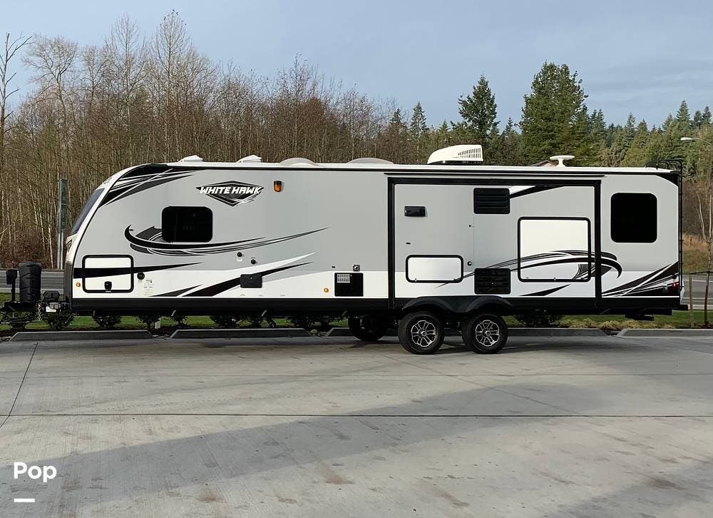 Call now about this 2019 Jayco White Hawk 31RL! 2019 Jayco White Hawk 31RL - Used Travel Trailer For Sale by Pop RVs in Kenmore, Washington features Awning, Slideout, Air Conditioning, Leveling Jacks