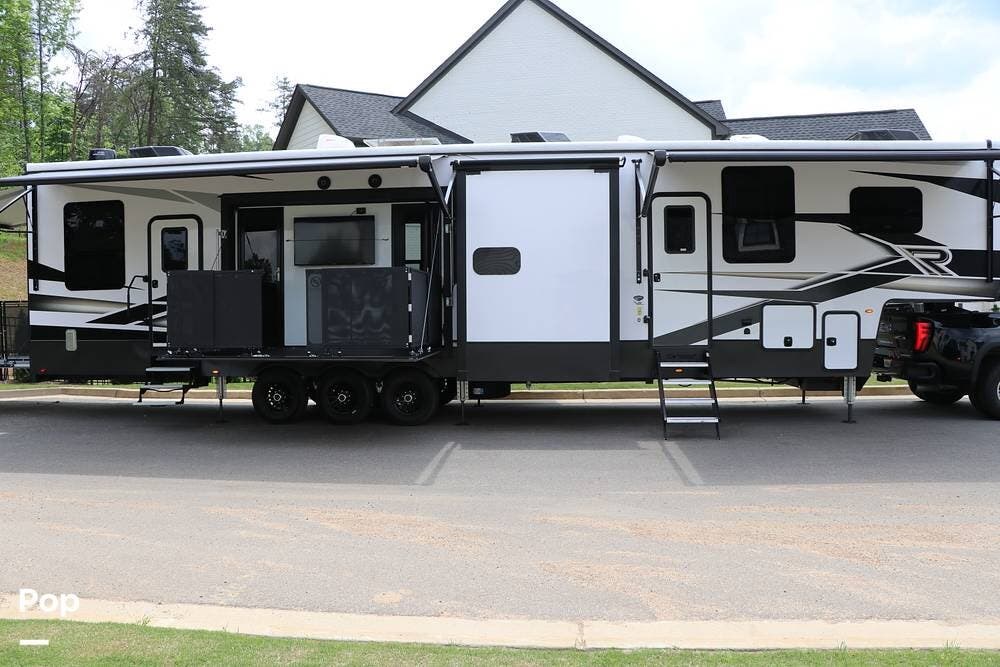 Call now about this 2023 Keystone Raptor 429! 2023 Keystone Raptor 429 - Used Toy Hauler For Sale by Pop RVs in Woodstock, Georgia features Leveling Jacks, Awning, Generator, Air Conditioning, Slideout