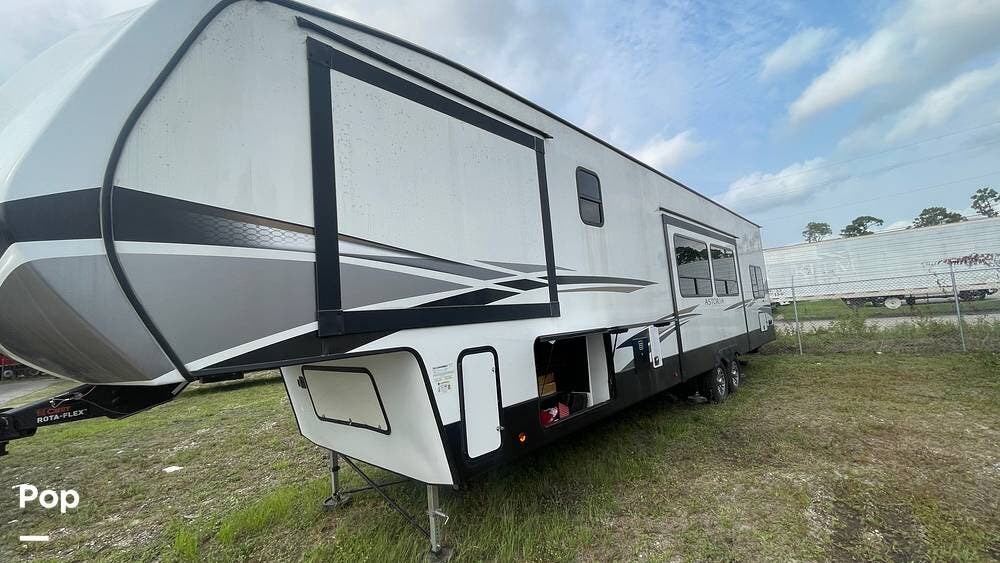 Call now about this 2022 Dutchmen Astoria Platinum 3603LFP! 2022 Dutchmen Astoria Platinum 3603LFP - Used Fifth Wheel For Sale by Pop RVs in North Fort Myers, Florida features Leveling Jacks, Awning, Slideout, Air Conditioning