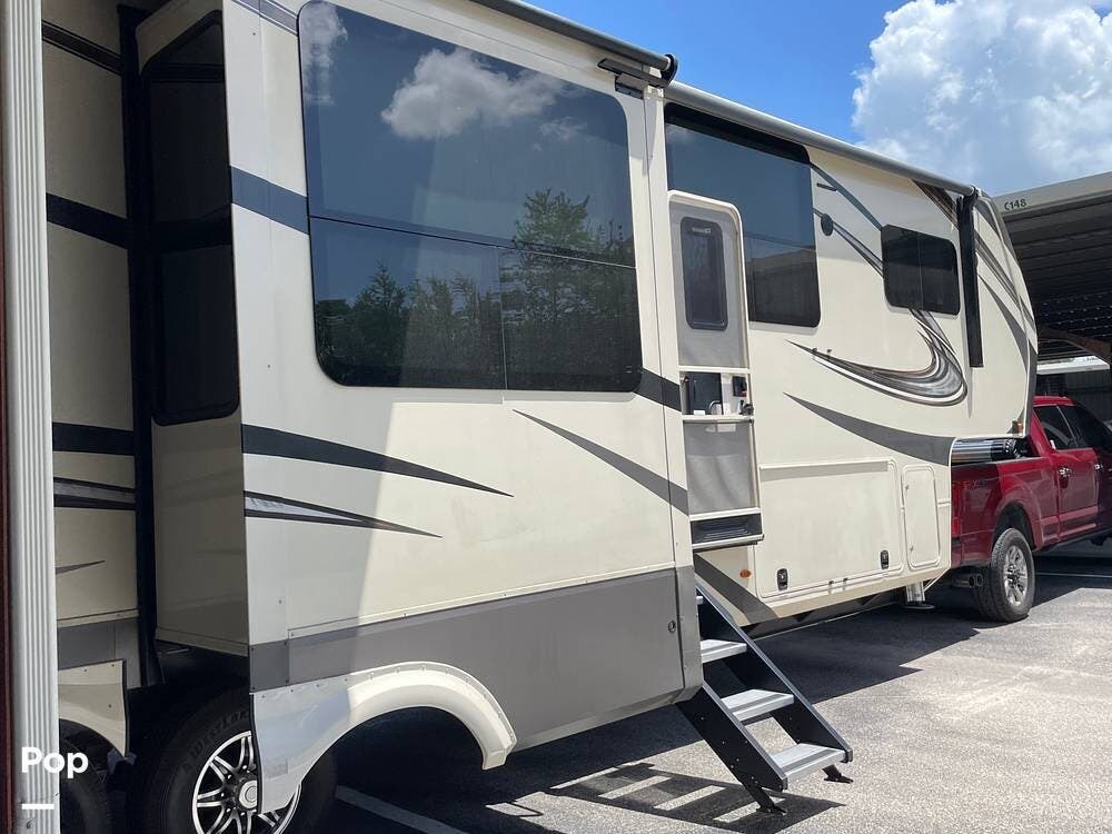 Call now about this 2021 Grand Design Solitude 390RK! 2021 Grand Design Solitude 390RK - Used Fifth Wheel For Sale by Pop RVs in Ft Myers, Florida features Awning, Slideout, Leveling Jacks, Air Conditioning