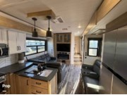 Call now about this 2022 Keystone Raptor 413! 2022 Keystone Raptor 413 - Used Toy Hauler For Sale by Pop RVs in Mesa, Arizona features Generator, Awning, Slideout, Air Conditioning, Leveling Jacks