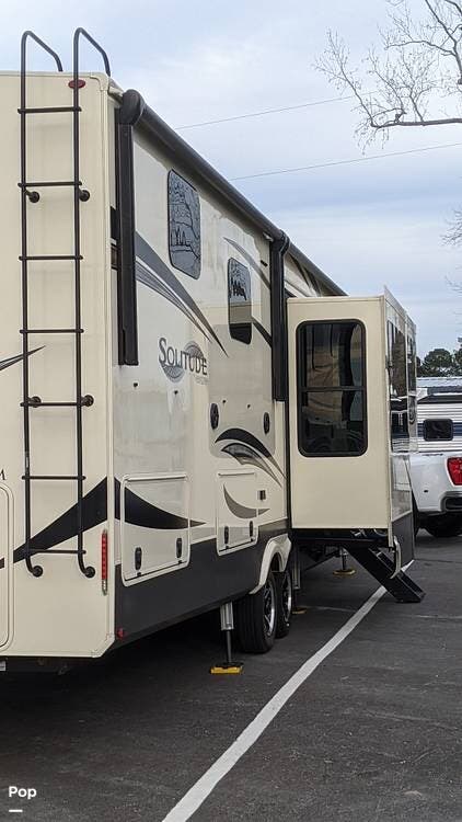 Call now about this 2021 Grand Design Solitude 380FL! 2021 Grand Design Solitude 380FL - Used Fifth Wheel For Sale by Pop RVs in Conway, South Carolina features Awning, Leveling Jacks, Slideout, Air Conditioning