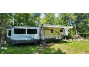 Call now about this 2021 Forest River Cedar Creek 377OF! 2021 Forest River Cedar Creek 377OF - Used Fifth Wheel For Sale by Pop RVs in The Forks, Maine features Awning, Air Conditioning, Generator, Slideout, Leveling Jacks