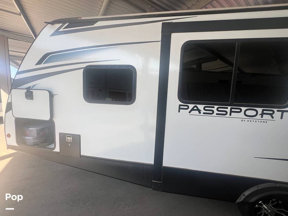 Call now about this 2021 Keystone Passport 229RK! 2021 Keystone Passport 229RK - Used Travel Trailer For Sale by Pop RVs in Surprise, Arizona features Slideout, Air Conditioning, Awning