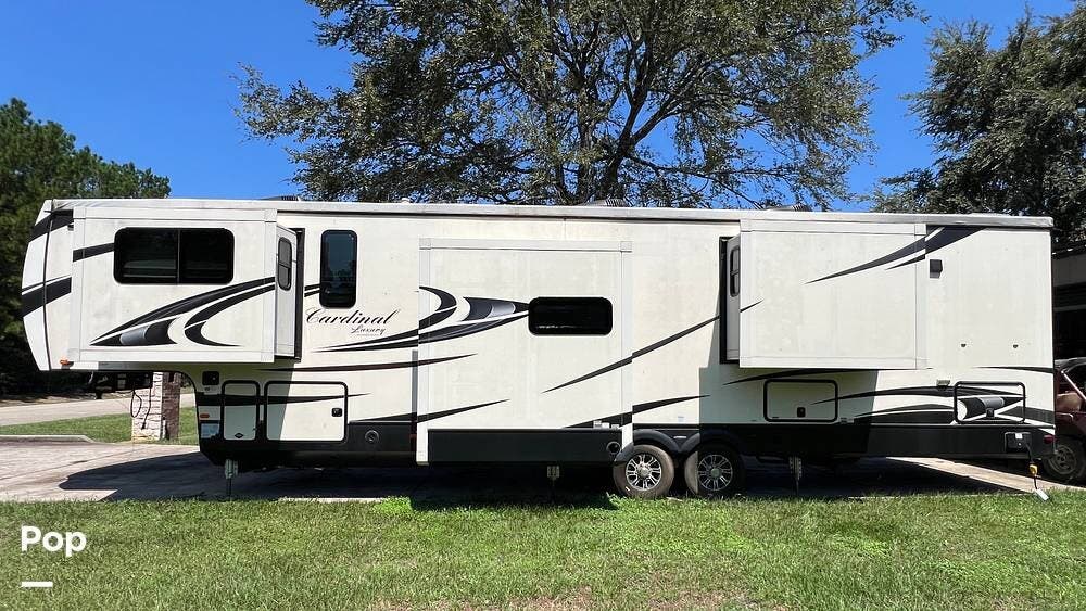 Call now about this 2020 Forest River Cardinal 370FLX! 2020 Forest River Cardinal 370FLX - Used Fifth Wheel For Sale by Pop RVs in Montgomery, Texas features Air Conditioning, Leveling Jacks, Awning, Slideout