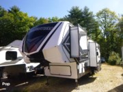 Call now about this 2019 Grand Design Momentum 351M! 2019 Grand Design Momentum 351M - Used Toy Hauler For Sale by Pop RVs in Henniker, New Hampshire features Leveling Jacks, Slideout, Awning, Air Conditioning, Generator