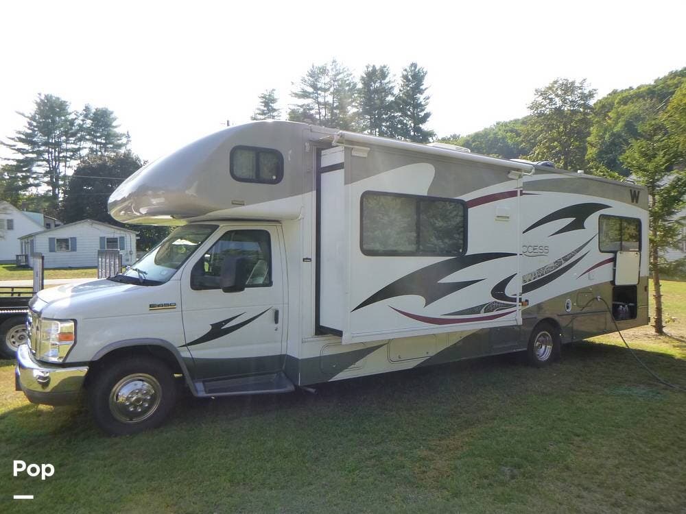 Call now about this 2013 Winnebago Access Premier 31JP! 2013 Winnebago Access Premier 31JP - Used Class C For Sale by Pop RVs in Claremont, New Hampshire features Awning, Air Conditioning, Generator, Slideout