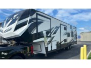Call now about this 2021 Dutchmen Voltage 3635! 2021 Dutchmen Voltage 3635 - Used Toy Hauler For Sale by Pop RVs in Palmetto, Florida features Leveling Jacks, Generator, Slideout, Air Conditioning, Awning