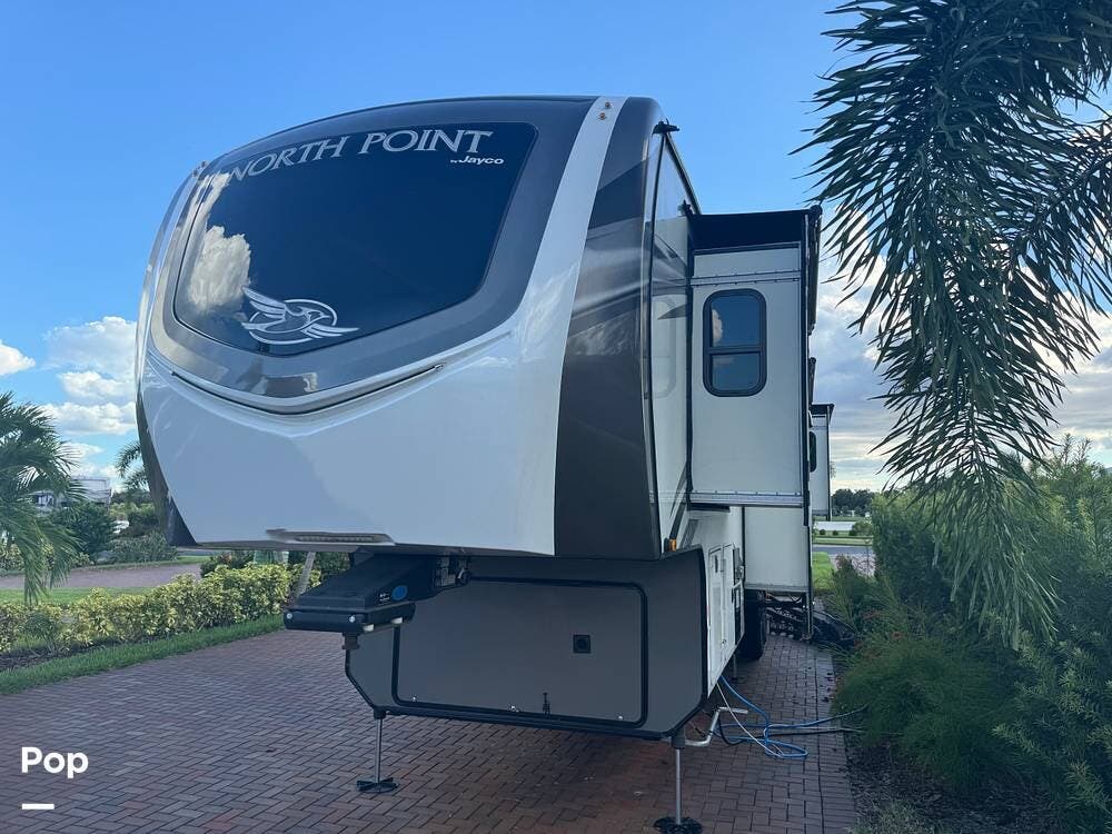 Call now about this 2021 Jayco North Point 382FLRB! 2021 Jayco North Point 382FLRB - Used Fifth Wheel For Sale by Pop RVs in Sarasota, Florida features Slideout, Air Conditioning, Awning, Leveling Jacks, Generator