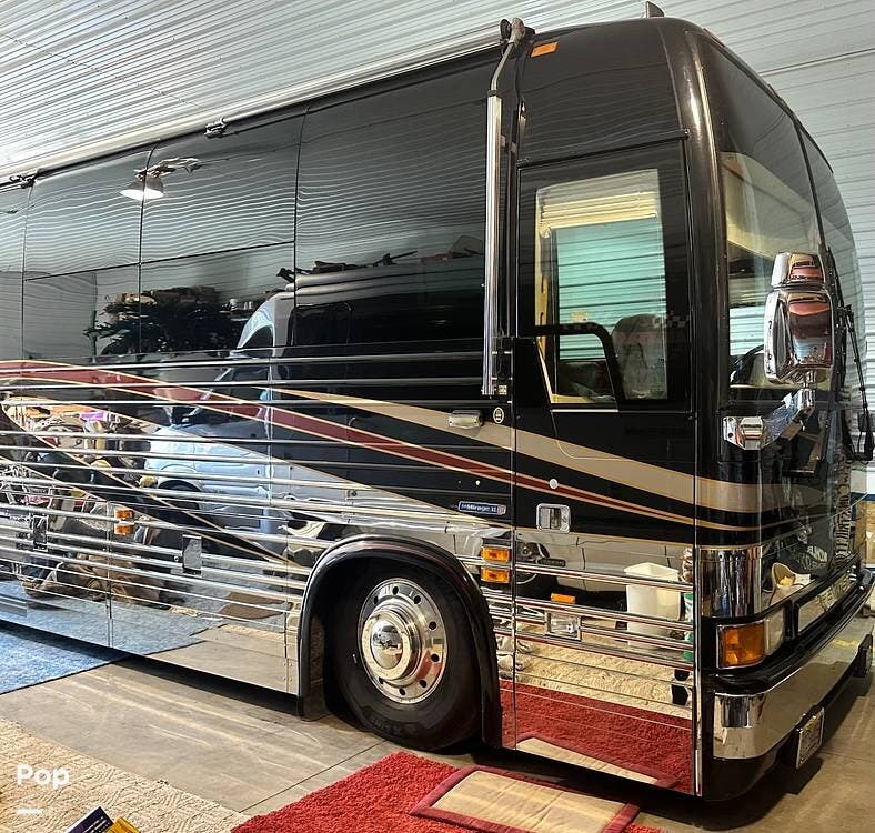 Call now about this 2002 Prevost Royale Royal Coach XLII! 2002 Prevost Royale Royal Coach XLII - Used Bus Conversion For Sale by Pop RVs in Bonduel, Wisconsin features Awning, Generator, Air Conditioning, Leveling Jacks
