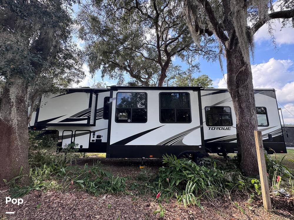 Call now about this 2019 Heartland Torque TQ327! 2019 Heartland Torque TQ327 - Used Toy Hauler For Sale by Pop RVs in Silver Springs, Florida features Air Conditioning, Awning, Leveling Jacks, Slideout