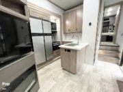 Contact us now about this 2023 Grand Design Momentum 320G Toy Hauler! 2023 Momentum 320G Toy Hauler by Grand Design from Pop RVs in Niceville, Florida